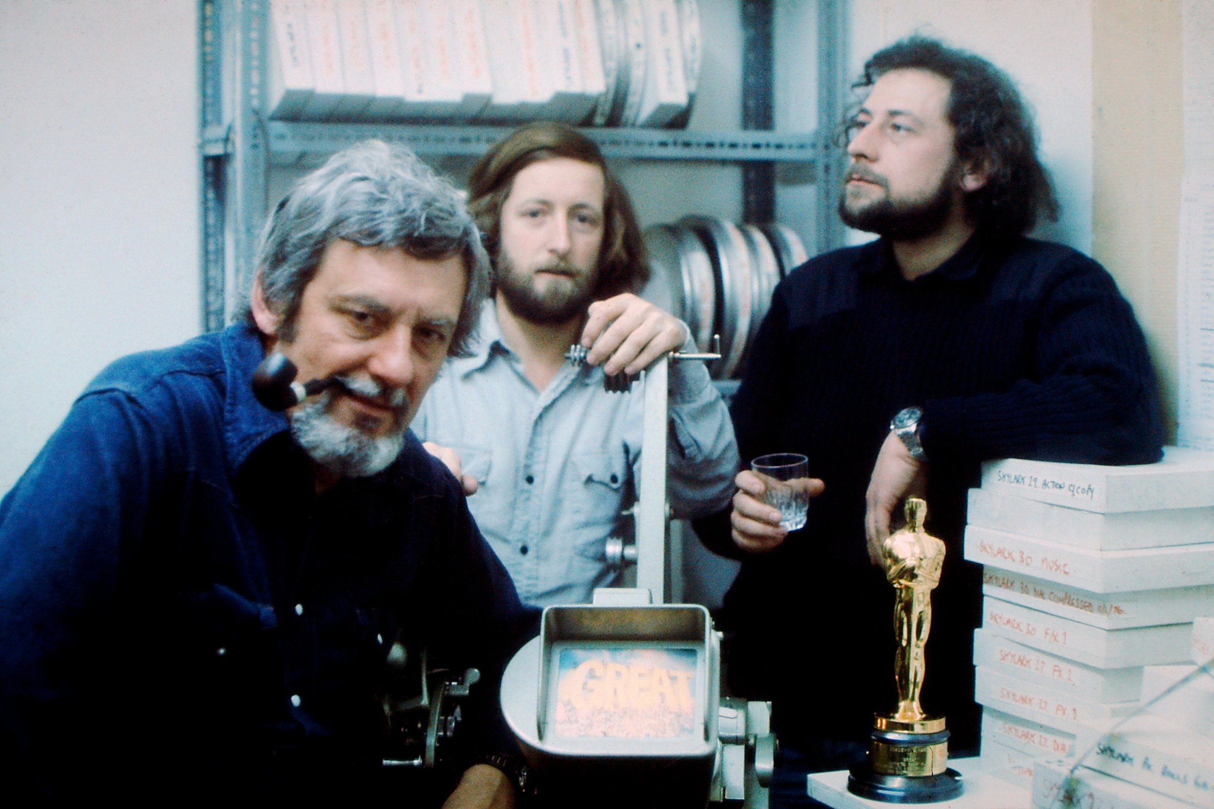 Bob Godfrey with Tony Fish and Peter Hearn at a Moviola, the Oscar standing on the bench.